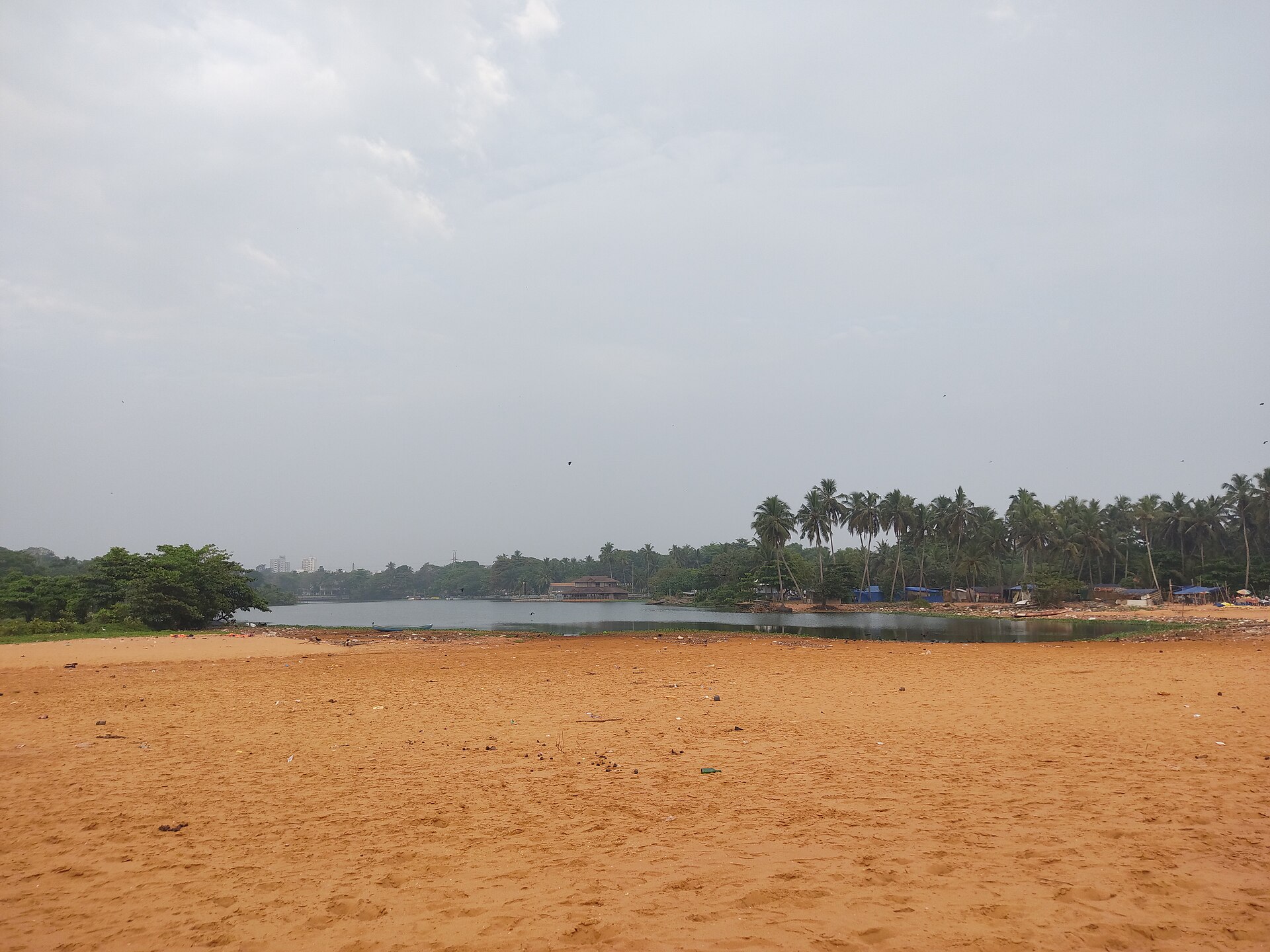 Where Veli Lake meets the sea. The floating bridge and the giant shell sculptures are the classic photo stops.